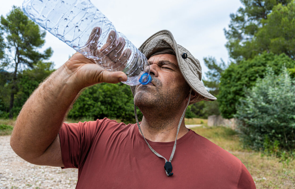 Caucasian,Hiker,Man,Wearing,A,Hat,And,Very,Sweaty,,Finishing