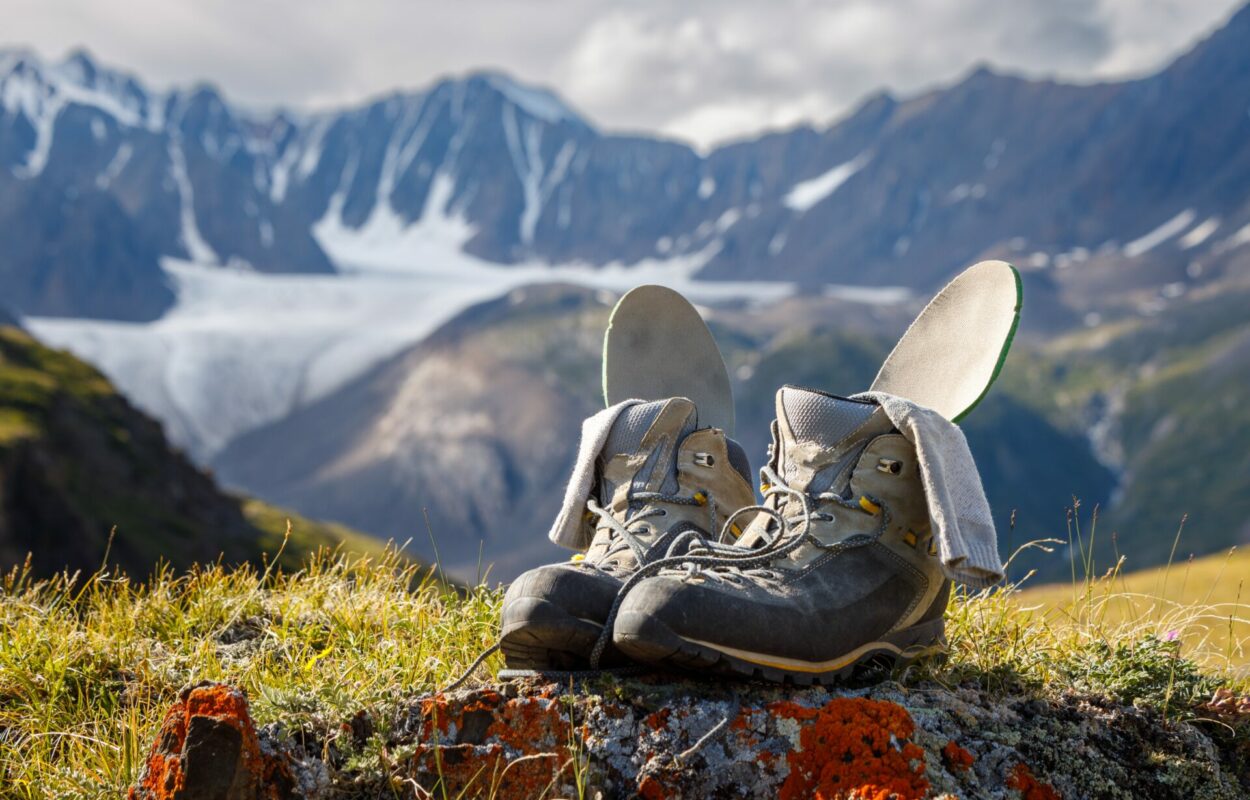 Trekking,Boots,With,Insoles,And,Socks,Dry,On,The,Background